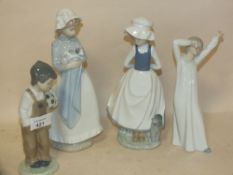 FOUR NEO FIGURES TO INCLUDE A BOY WITH A FOOTBALL