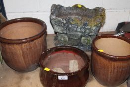 THREE GLAZED PLANT POTS PLUS A SMALL TROLLEY SHAPED PLANTER