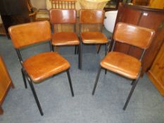 A SET OF FOUR MODERN BROWN LEATHER DINING CHAIRS