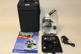 A MODERN CASED BRESSER BIOLUX AL MICROSCOPE