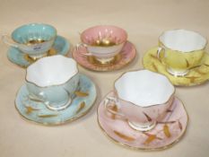 TWO ROYAL GRAFTON CUPS AND SAUCERS WITH HAND PAINTED FRUIT DECORATION TO INTERIOR, TOGETHER WITH