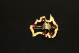 AN UNUSUAL BROOCH IN THE SHAPE OF AUSTRALIA