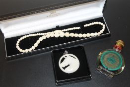 A 1950s 4711 PERFUME TOGETHER WITH A BONE NECKLACE & SILVER FRAMED PENDANT