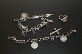 A SILVER CHARM BRACELET, TOGETHER WITH A SILVER COIN SET BRACELET (BROKEN) A SILVER CROSS PENDANT