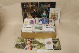 A LARGE QUANTITY OF FIRST DAY COVERS TOGETHER WITH A CORONATION JUBILEE 2003 £5 COIN