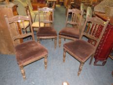 A SET OF FOUR ANTIQUE OAK DINING CHAIRS