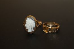 A HALLMARKED 18 CARAT GOLD BUCKLE RING (STONE MISSING) TOGETHER WITH A HALLMARKED 18 CARAT GOLD