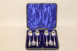 A CASED SET OF SIX HALLMARKED SILVER TEASPOONS AND SUGAR TONGS