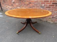 A WILLIAM IV MAHOGANY AND SATINWOOD OVAL TILT-TOP TABLE ON TURNED COLUMN AND FOUR REEDED