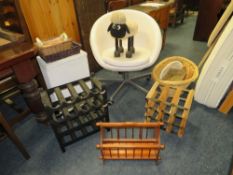 A WHITE SWIVEL CHAIR, WINE RACKS, BASKETS ETC.