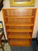 A RETRO TEAK OPEN FRONTED BOOKCASE, W 81 CM, A/F