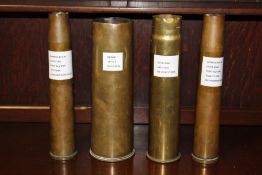 FOUR LARGE MILITARY BRASS ARTILLERY SHELL CASES