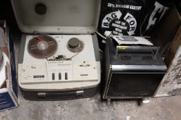A SOLID STATE TV TOGETHER WITH A REEL TO REEL PLAYER