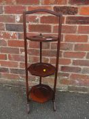 A MAHOGANY THREE TIER DUMB WAITER