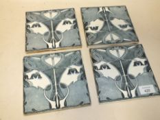 A SET OF FOUR ART NOUVEAU TILES