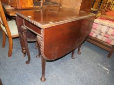 A MAHOGANY PIECRUST DROPLEAF TABLE DINING TABLE