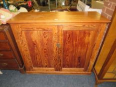 AN ANTIQUE PINE TWO DOOR SCHOOL STYLE CUPBOARD, H 108 SM, W 128 CM