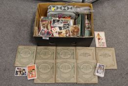A QUANTITY OF CIGARETTE CARDS BOTH LOOSE AND IN ALBUMS