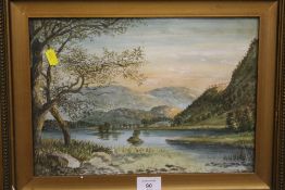A GILT FRAMED AND GLAZED WATERCOLOUR OF A HILLSIDE LAKE SCENE SIGNED LOWER LEFT W W GODARD ? 1966, H