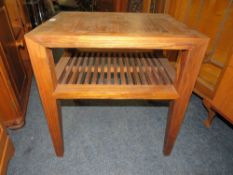 A MODERN TWO TIER OCCASIONAL TABLE