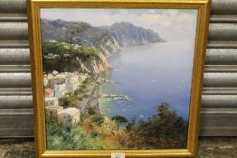 A GILT FRAMED OIL ON CANVAS DEPICTING A CONTINENTAL HARBOUR SCENE WITH BOATS AND SEA CLIFFS SIGNED