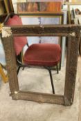 AN ANTIQUE GILT PICTURE FRAME A/F - REBATE 51 CM BY 64.5 CM