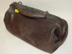 A SMALL LEATHER GLADSTONE BAG