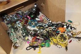 A BOX OF COSTUME JEWELLERY