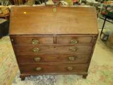 A LARGE 19TH CENTURY MAHOGANY COUNTRYMADE BUREAU WITH AN INLAID INTERIOR - H 110 CM, W 107 CM