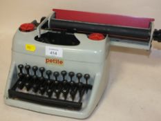 A PETITE CHILDS TYPEWRITER