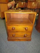 A SMALL PINE TWO DRAWER BEDSIDE CHEST