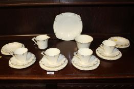 A SMALL TRAY ART DECO ALFRED MEAKIN MARIGOLD PATTERN PRINCESS SHAPED CHINA, TO INCLUDE FOUR TRIOS