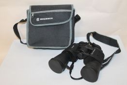 A PAIR OF BRESSER BAK-4 LONG EYE RELIEF 10 X 50 BINOCULARS