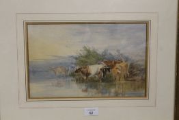 A GILT FRAMED AND GLAZED WATERCOLOUR OF CATTLE WATERING H 19 CM BY W 30 CM