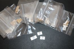 A QUANTITY OF NOVELTY MINIATURE SILVER FLAGS