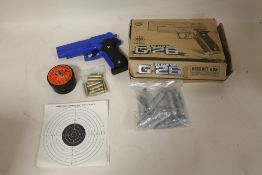A BOXED G26 BB GUN TOGETHER WITH AIR RIFLE PELLETS, TARGETS ETC