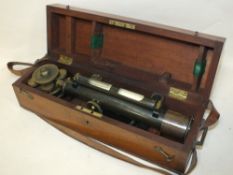 A CASED VINTAGE KEYZOR AND BENDON MILITARY STYLE COMBINATION TELESCOPE AND COMPASS WITH SPIRIT