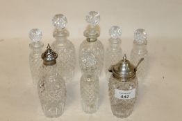 AN UNUSUAL CRUET BOTTLE WITH NEWCASTLE HALLMARK SILVER SCOOP ATTACHMENT, TOGETHER WITH AN EARLY