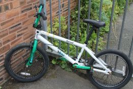 A GREEN AND WHITE BMX