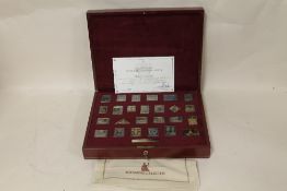 A CASED SET OF HALLMARKED SILVER 'THE EMPIRE COLLECTION' STAMPS