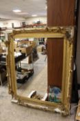 A LARGE 19TH CENTURY GOLD DECORATIVE SWEPT FRAME - WITH DAMAGES, frame W 17 cm, rebate 120 x 97 cm
