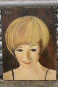 AN UNFRAMED OIL ON CANVAS PORTRAIT STUDY OF A LADY SIGNED UPPER LEFT I.ANS