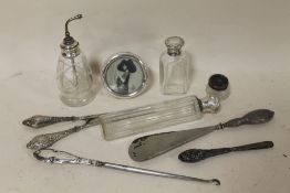 A BAG OF COLLECTABLES TO INCLUDE A SMALL HALLMARKED SILVER PICTURE FRAME, GLOVE STRETCHERS, VANITY