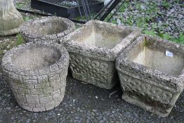 A PAIR OF CELTIC DESIGN STONE PLANTERS TOGETHER WITH A PAIR OF BRICK EFFECT STONE PLANTERS (4)