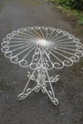 A WHITE PAINTED METAL GARDEN TABLE