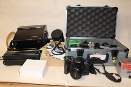 A MINOLTA DYNAX 7 CAMERA TOGETHER WITH A LARGE QUANTITY OF RELATED ACCESSORIES TO INCLUDE A TAMRON