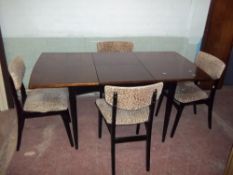 AN EXTENDING SAPPELE DINING TABLE AND FOUR CHAIRS