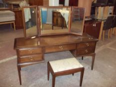 A STAG MINSTREL TRIPLE MIRROR DRESSING TABLE AND STOOL
