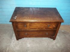 AN OAK TWO DRAWER VINTAGE CHEST