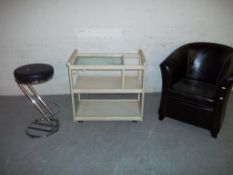 THREE MODERN ITEMS TO INCLUDE A TUB CHAIR, A CHROME STOOL AND A SERVING TROLLEY